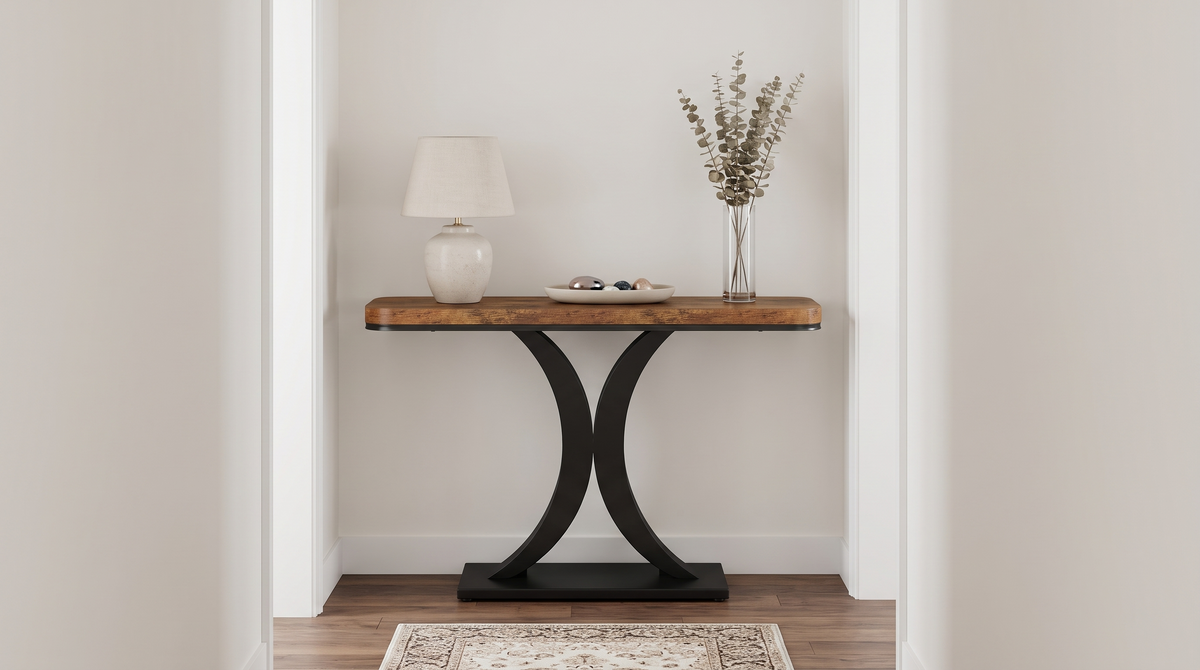 Hourglass base console table in a narrow hallway
