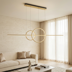 Gold ring bar pendant lighting a living room with sheer curtains
