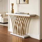 Gold base console with a pale marble top in a living room below framed art