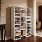 White shoe storage cabinet packed with shoes beside a hall console and chair