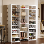 Tall white shoe rack of open cubbies filled with shoes and boots in a hallway