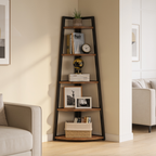 Rustic brown and black five tier corner shelf styled with books and a plant by a sofa