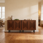 Wide room view of two low slatted cabinets on black legs across a wood floor