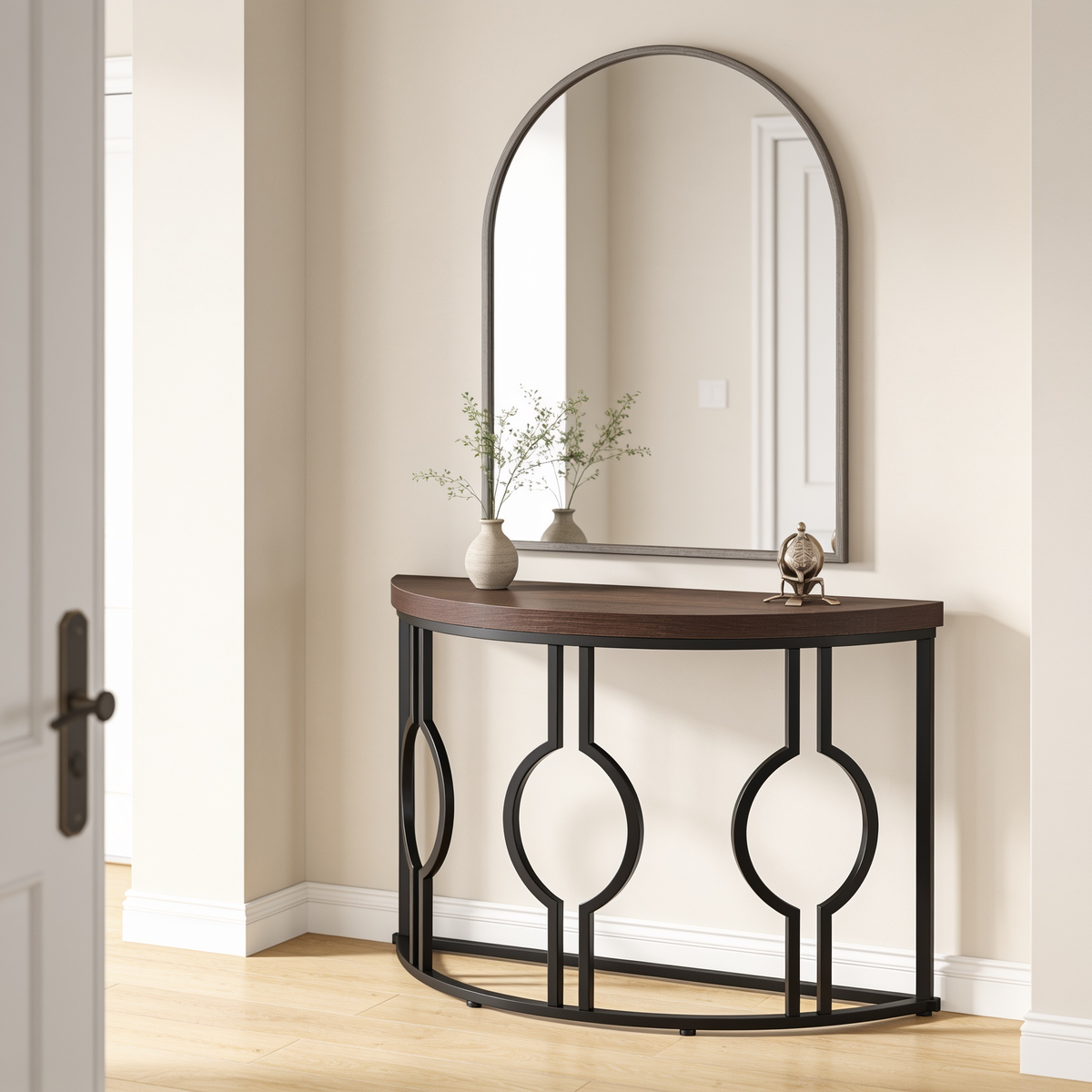 Black metal half moon console table with wood top under an arched hallway mirror