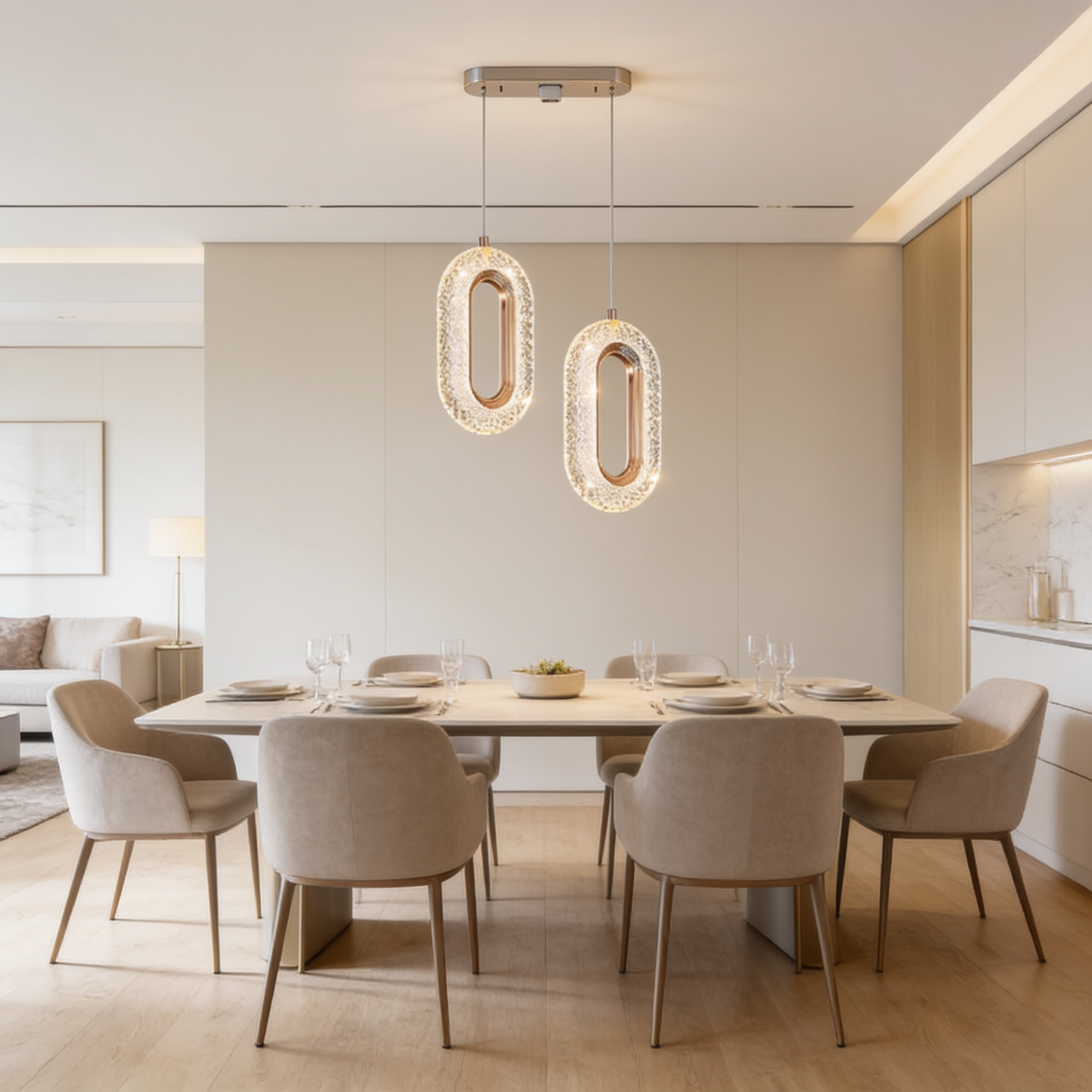 Two oblong crystal ring pendants lit above a dining table by a window
