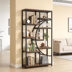 Open frame bookshelf in a white room with a cream sofa and small plants