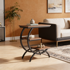 Three tier end table beside a dark sofa in a living room with a leafy plant