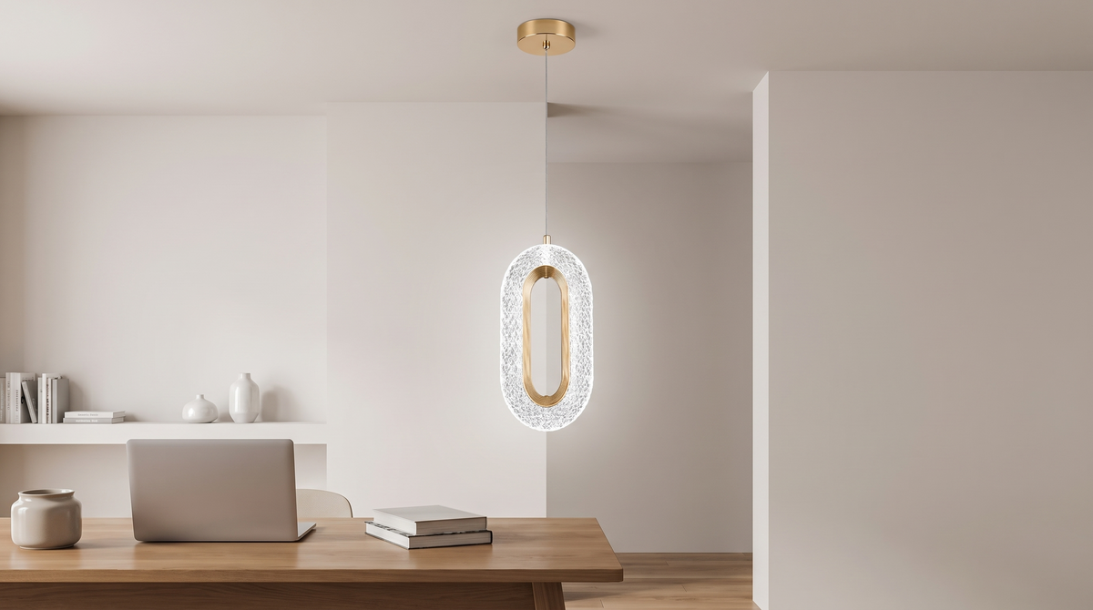 Crystal ring pendant lit in cool white over a desk