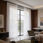 Sheer white panels along a wall of windows in a wide living room