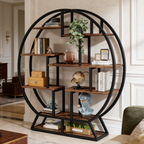 Circle frame etagere front on, filled with books, boxes, a globe and a trailing plant