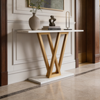 White top console on a gold V base holding vases and a small lamp in a hall