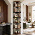 Curved corner bookcase beside a marble fireplace in a bright living room