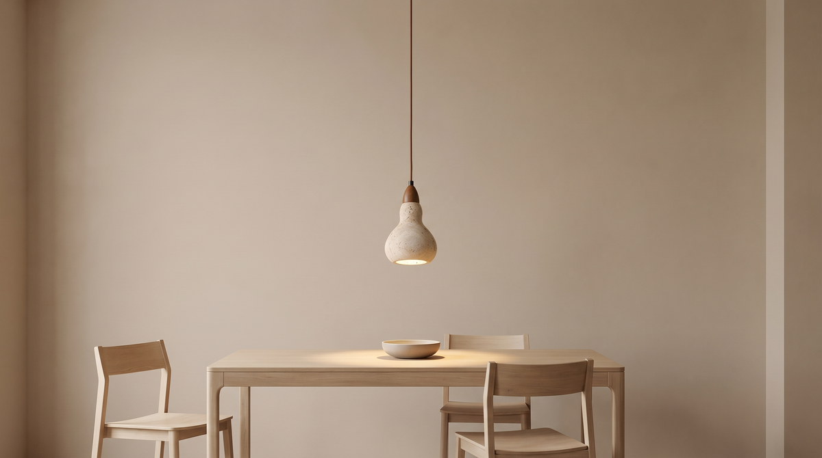 Stone pendant on a long drop over a dining table