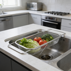 Extending drain basket set over a sink seen from the side with washed greens inside