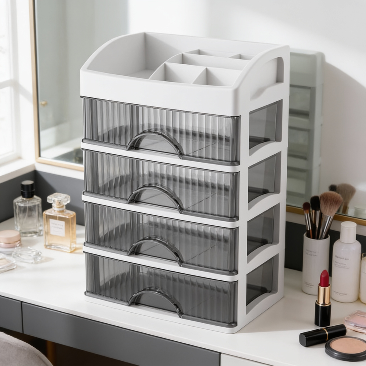 Five tier cosmetic drawers beside brushes and perfume on a dressing table