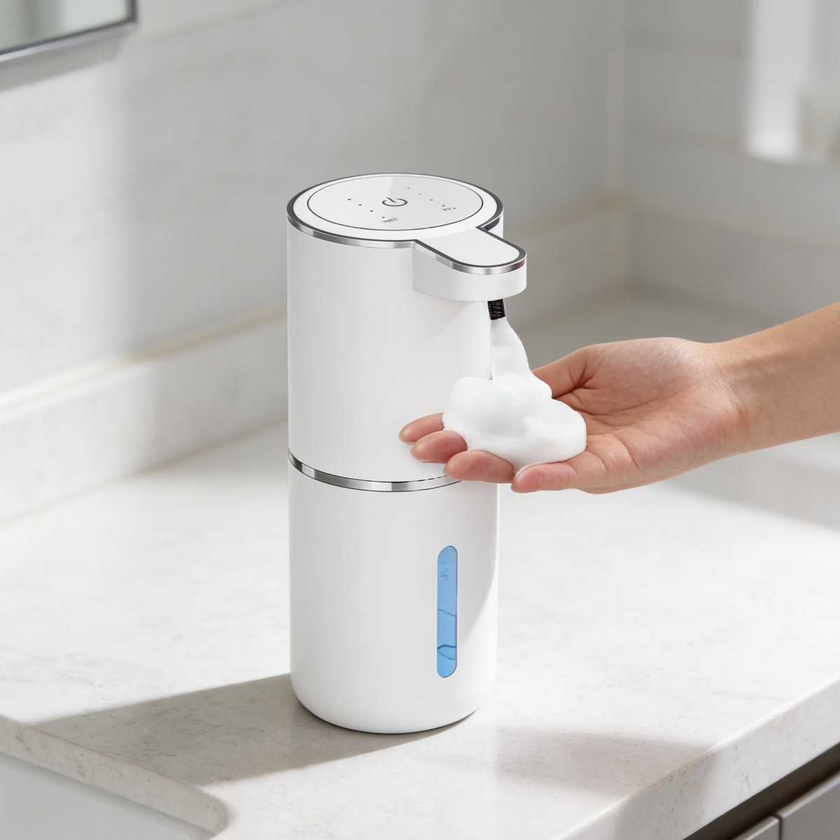 Tall white soap pump with a level window releasing foam into a waiting hand