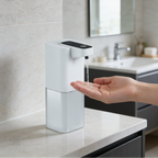 Hand held under the sensor pump on a counter with a vanity and window behind