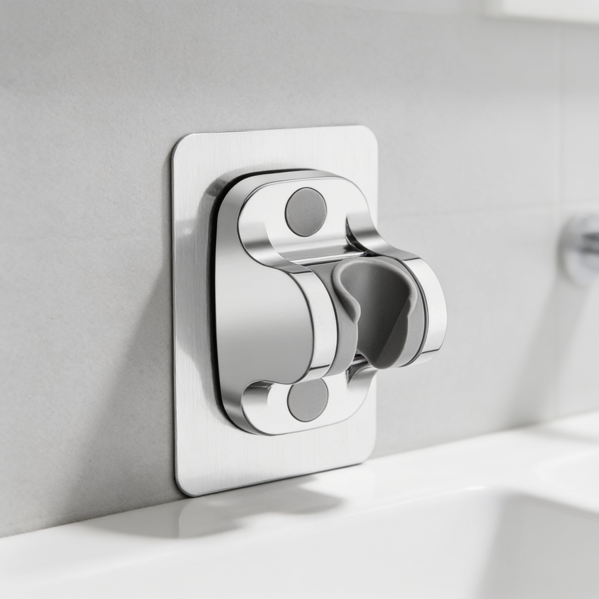 Chrome adjustable shower head holder mounted on a tiled wall