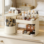 Cream brush organizer with a rotating cup and two clear drawers on a vanity