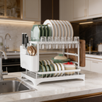 Side view of the white dish rack holding plates bowls and a silverware caddy