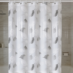Leaf print bath curtain pulled closed across a shower alcove next to a toilet
