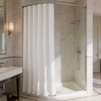 White bath curtain closed across a corner shower stall with a chrome mixer