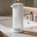 Ribbed dispenser on its round base at the edge of a bathroom sink