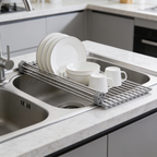 Roll up rack over a sink drying a stack of plates, a bowl and a cup