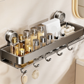 Close view of the wall shelf loaded with toiletries and brushes hanging from its hooks