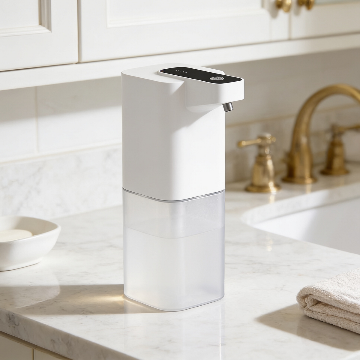 Automatic soap pump standing close to a basin with a gold faucet behind