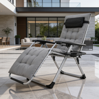 Gray cushioned zero gravity recliner on a patio in front of a modern house