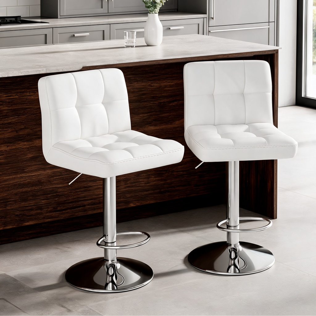 Two white tufted counter stools with round chrome bases at a dark wood island