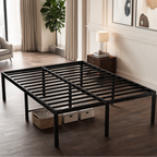 Black metal platform bed frame on a wood floor with baskets stored beneath