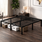 Black metal platform bed frame with baskets below, a plant and lamp behind