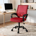 Red mesh back office chair in a bright office with a monitor on a wood desk