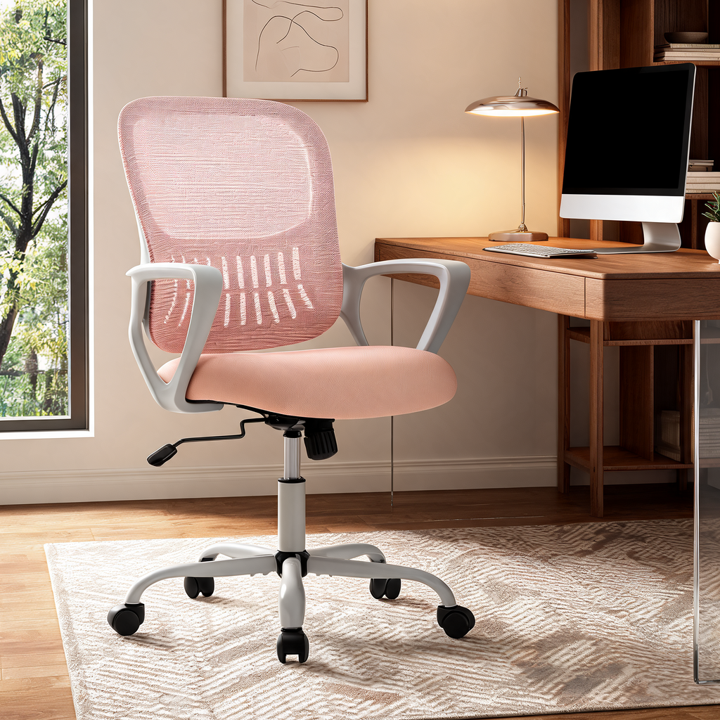 Pink seat office chair with a white five star base at a desk beside a window with trees outside