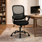 Black seat task chair with gray mesh back at a wooden desk with a monitor and bookshelves